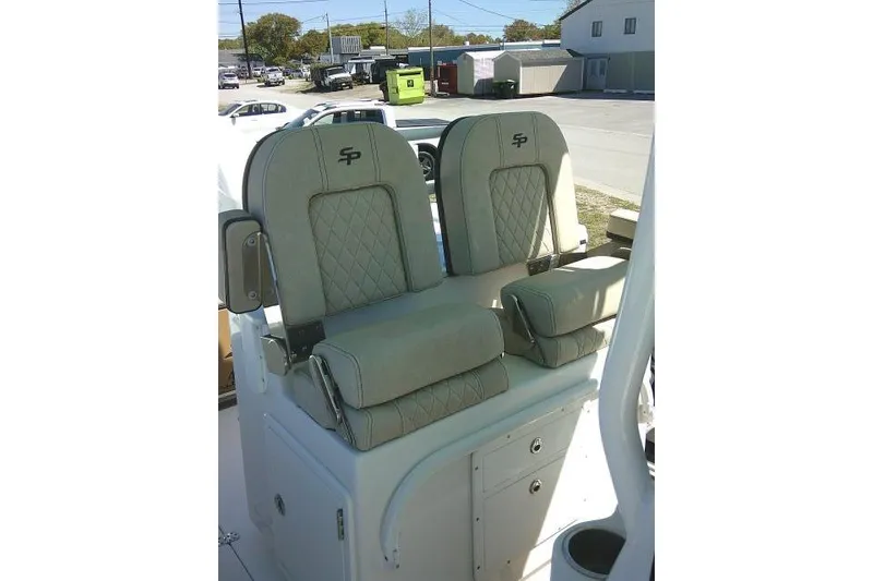 Slide: The Image of 2022 Sea Pro 259 Center Console boat seats with quilted design and armrests. - 37