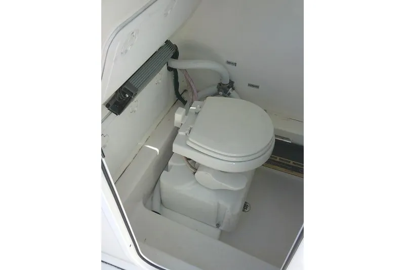 Slide: The Image of 2022 Sea Pro 259 Center Console boat interior with marine toilet. - 40