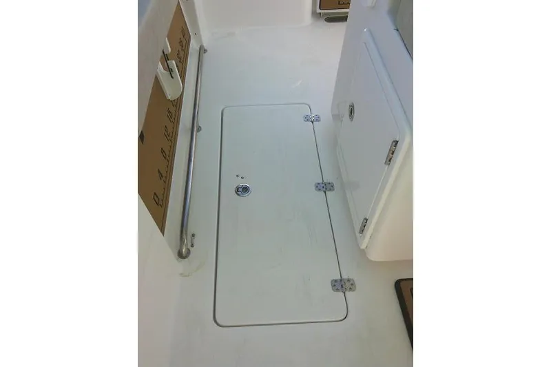 Slide: The Image of 2022 Sea Pro 259 Center Console deck with storage hatch and railing. - 42