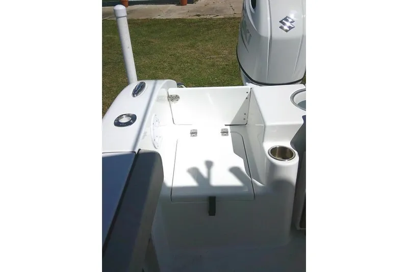 Slide: The Image of 2022 Sea Pro 259 Center Console boat interior with seating and engine detail. - 43