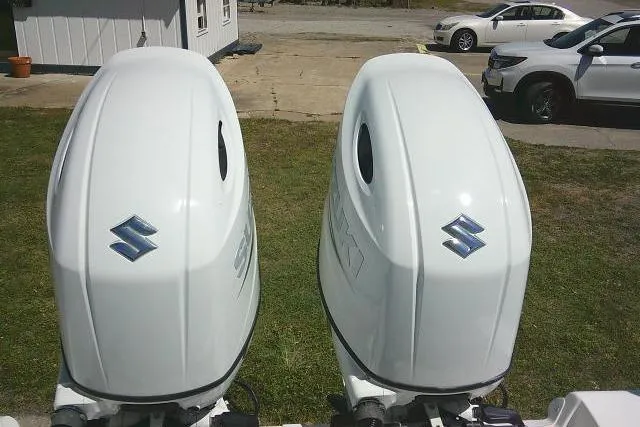Slide: The Image of Twin Suzuki outboard motors on a 2022 Sea Pro 259 Center Console boat. - 45