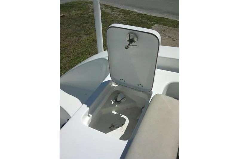 Slide: The Image of Open storage compartment on 2022 Sea Pro 259 Center Console boat. - 47