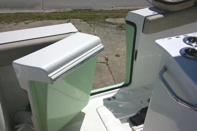 Slide: The Image of 2022 Sea Pro 259 Center Console boat interior with seating and storage compartments. - 48