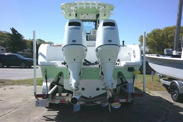 Slide: The Image of 2022 Sea Pro 259 Center Console with dual outboard engines, rear view. - 5