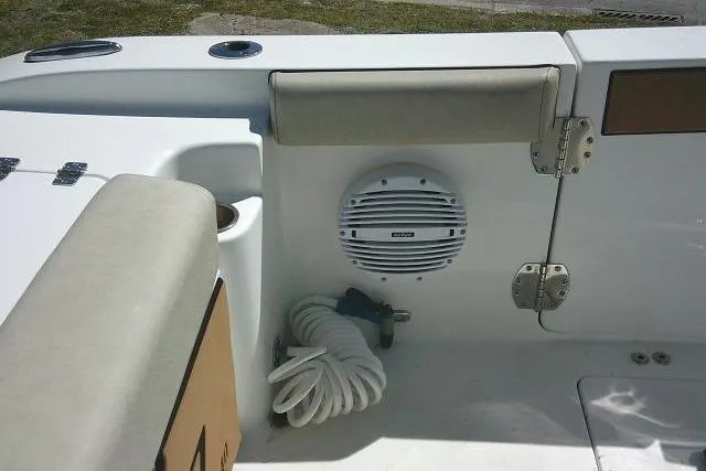 Slide: The Image of 2022 Sea Pro 259 Center Console boat interior with speaker and coiled rope. - 50