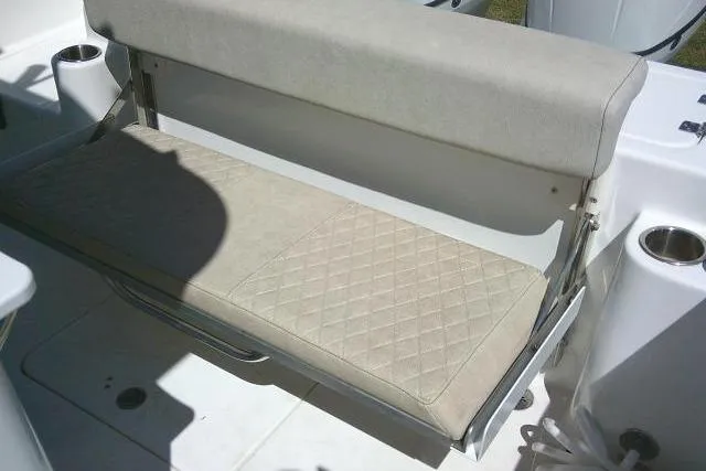 Slide: The Image of 2022 Sea Pro 259 Center Console boat seat with diamond-pattern upholstery. - 57