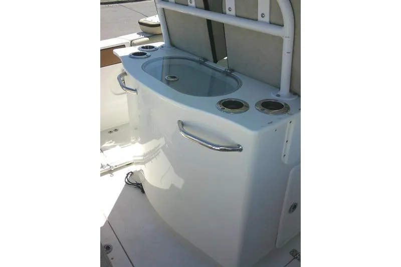 Slide: The Image of 2022 Sea Pro 259 Center Console boat's sleek livewell and rod holders. - 58