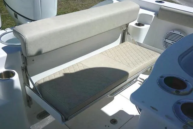 Slide: The Image of 2022 Sea Pro 259 Center Console boat seat with diamond-pattern upholstery. - 62