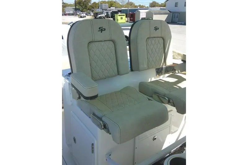 Slide: The Image of 2022 Sea Pro 259 Center Console boat seats with diamond stitching and armrests. - 63