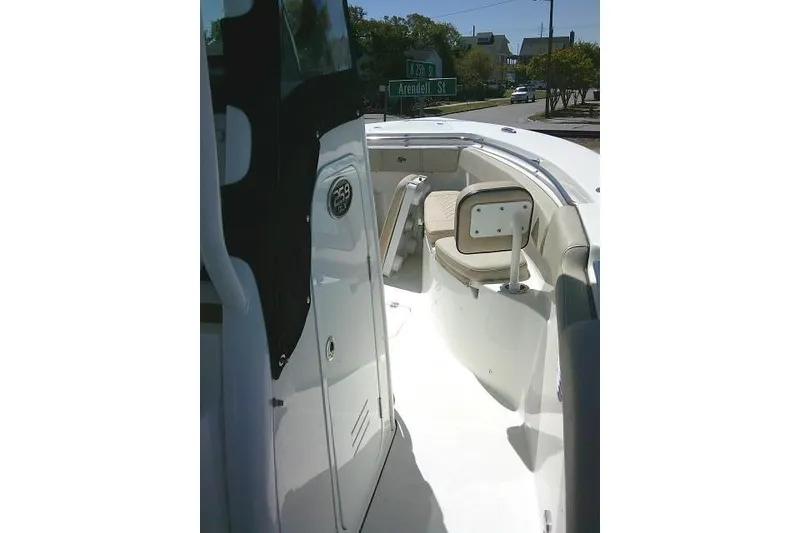 Slide: The Image of 2022 Sea Pro 259 Center Console boat interior with seating and storage compartments. - 85