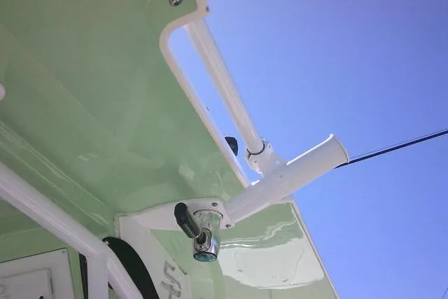 Slide: The Image of Rod holder on 2022 Sea Pro 259 Center Console against clear blue sky. - 86