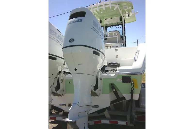 Slide: The Image of 2022 Sea Pro 259 Center Console boat with dual Suzuki outboard engines. - 88