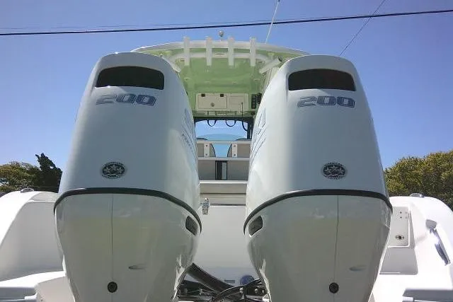 Slide: The Image of 2022 Sea Pro 259 Center Console with dual 200 horsepower engines, rear view. - 89