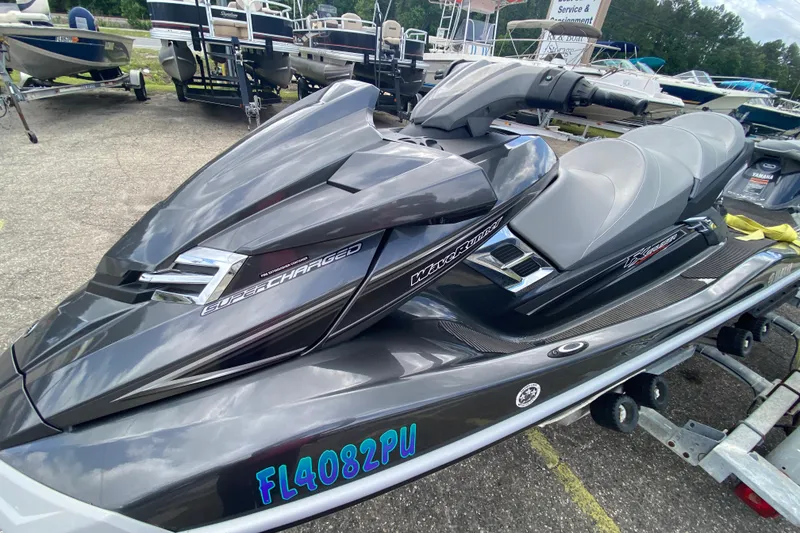 Slide: The Image of 2013 Yamaha WaveRunner FX Cruiser SHO jet ski on trailer, parked among boats. - 7