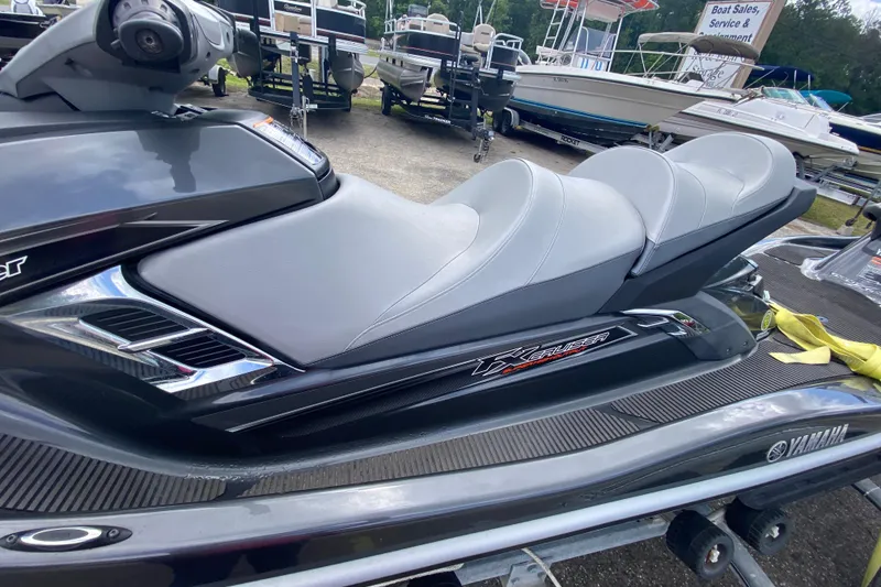 Slide: The Image of 2013 Yamaha WaveRunner FX Cruiser SHO, sleek design, gray seating, on trailer. - 8