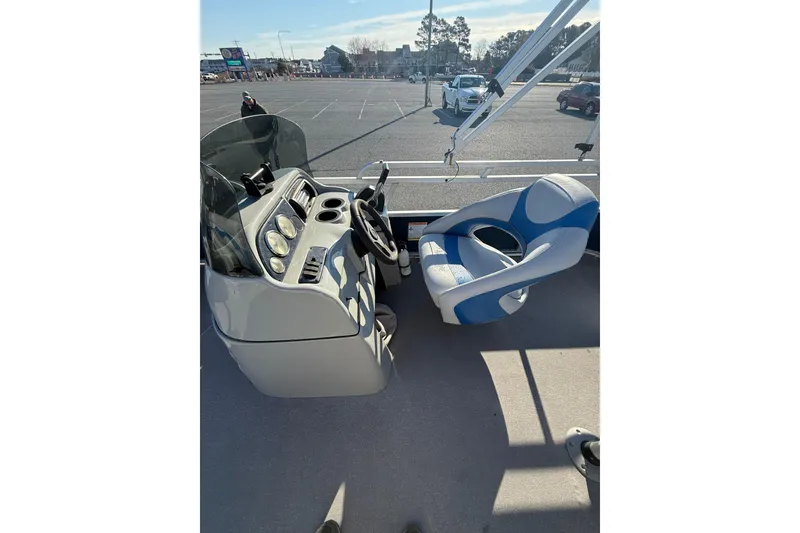 Slide: The Image of Cockpit of 2012 SunCatcher LV 228 Cruise boat with steering wheel and blue captain's chair. - 12