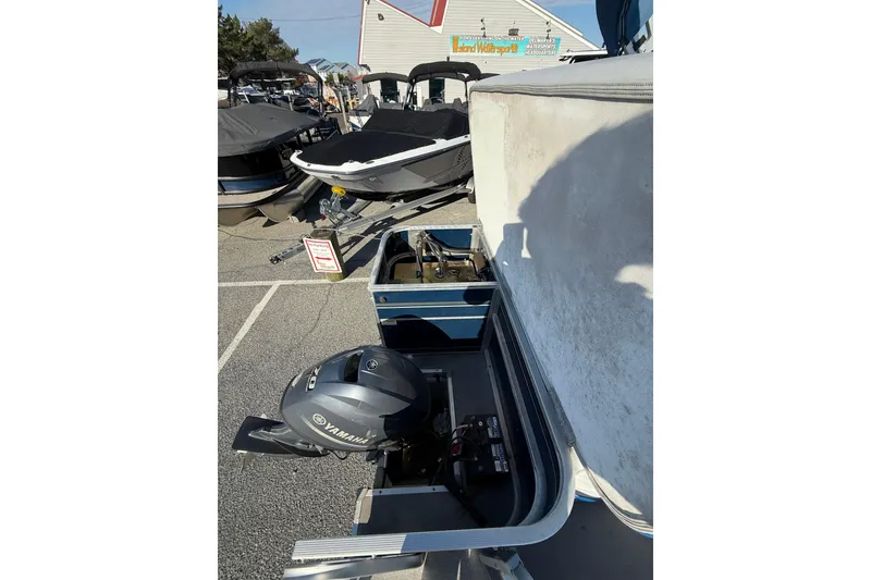 Slide: The Image of 2012 SunCatcher LV 228 Cruise boat with Yamaha motor in a marina setting. - 14