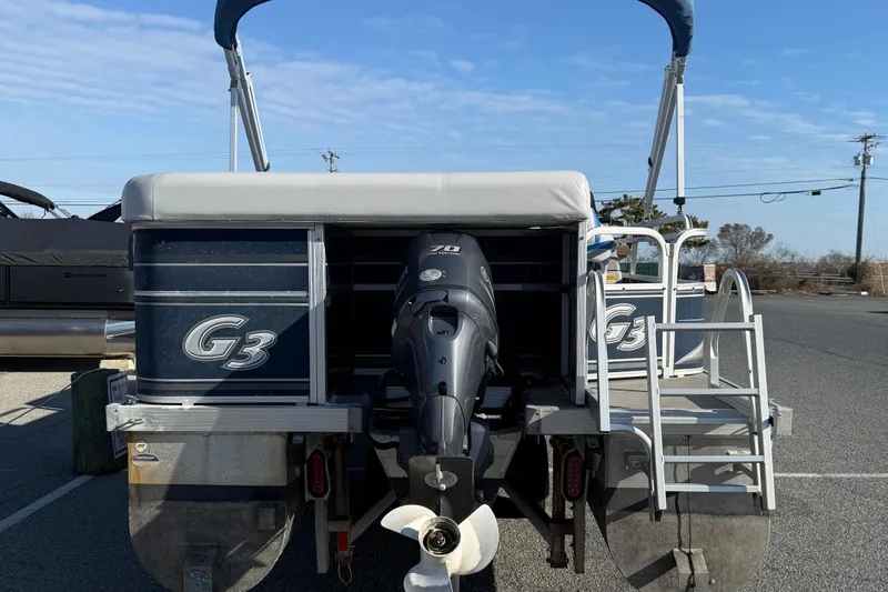 Slide: The Image of 2012 SunCatcher LV 228 Cruise pontoon boat with outboard motor, parked on asphalt. - 7