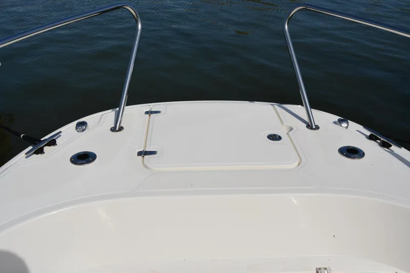Slide: The Image of Bow view of 2021 Boston Whaler 270 Dauntless boat on water. - 13