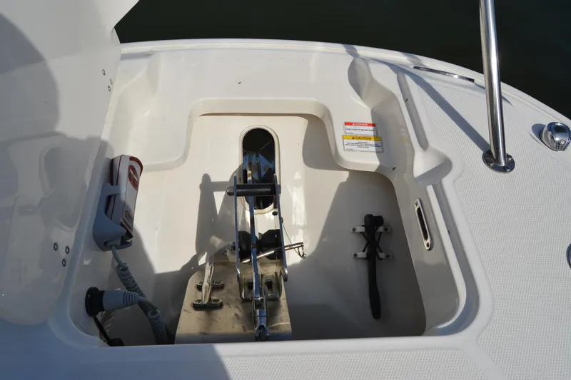Slide: The Image of Anchor storage compartment on a 2021 Boston Whaler 270 Dauntless boat deck. - 14