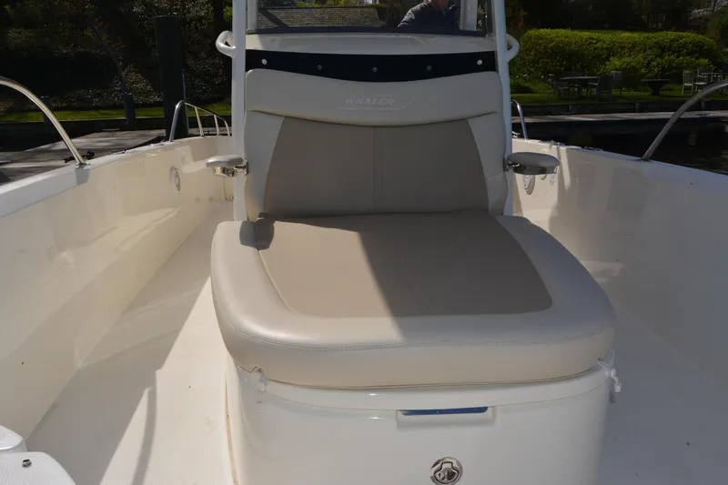 Slide: The Image of 2021 Boston Whaler 270 Dauntless boat interior with cushioned seating. - 16