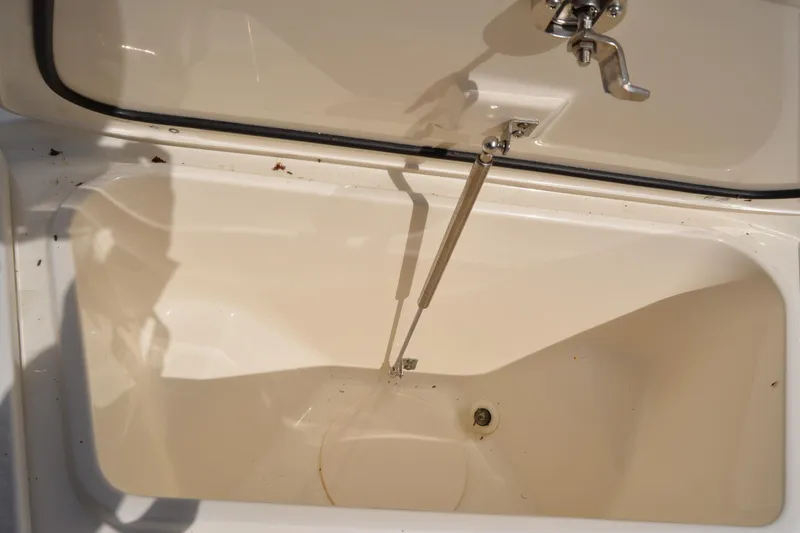 Slide: The Image of Open storage compartment on a 2021 Boston Whaler 270 Dauntless boat. - 27