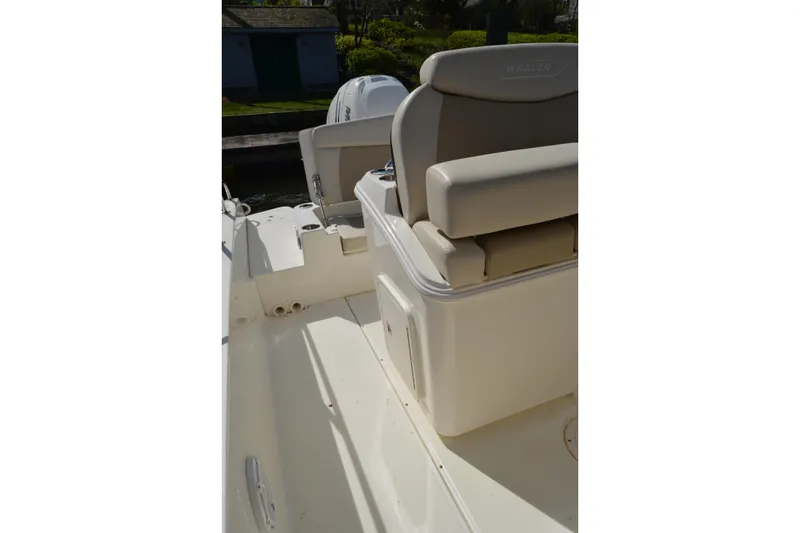 Slide: The Image of 2021 Boston Whaler 270 Dauntless boat interior with seating and storage. - 31