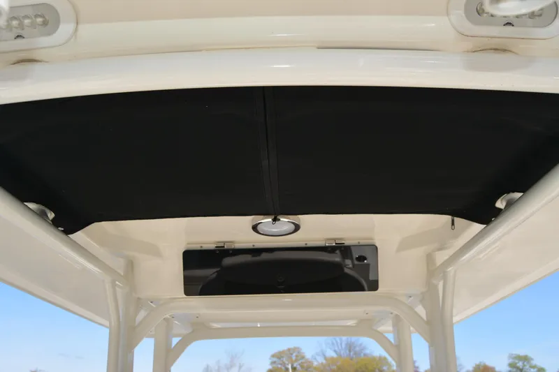 Slide: The Image of 2021 Boston Whaler 270 Dauntless T-top interior with black canvas cover. - 35