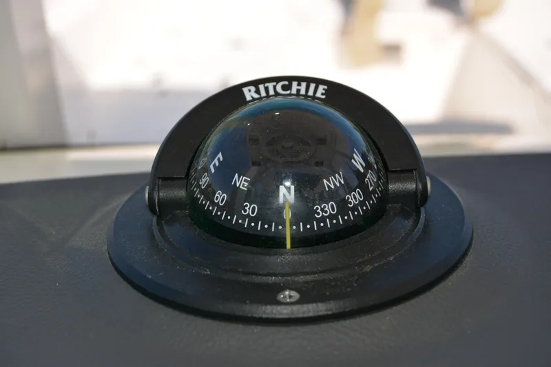 Slide: The Image of Compass on 2021 Boston Whaler 270 Dauntless boat dashboard. - 38