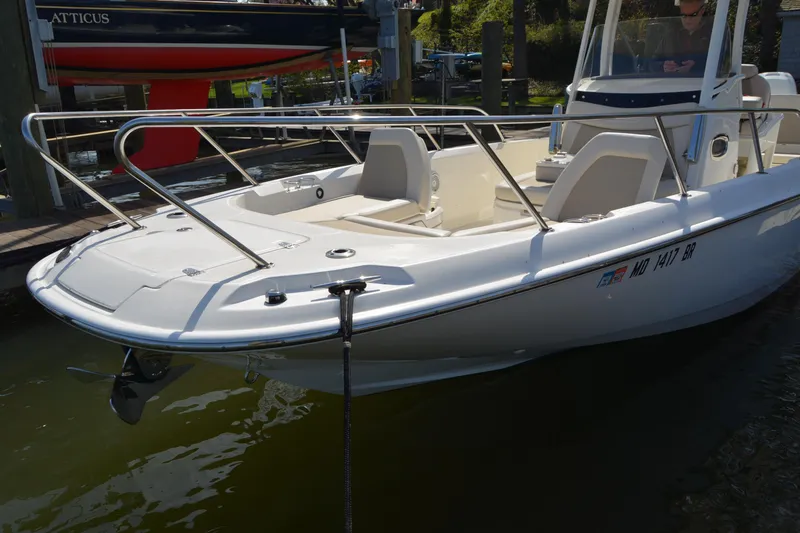Slide: The Image of 2021 Boston Whaler 270 Dauntless boat docked in marina, side view. - 4