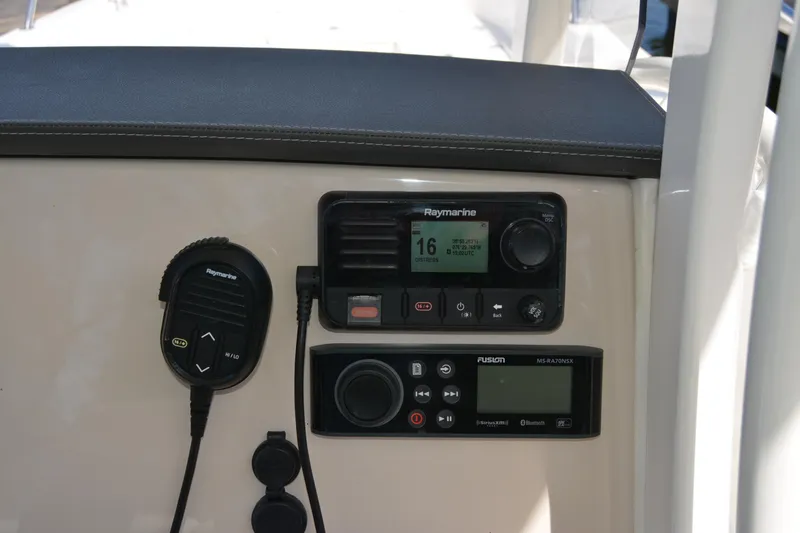 Slide: The Image of Control panel of 2021 Boston Whaler 270 Dauntless with Raymarine and Fusion systems. - 42