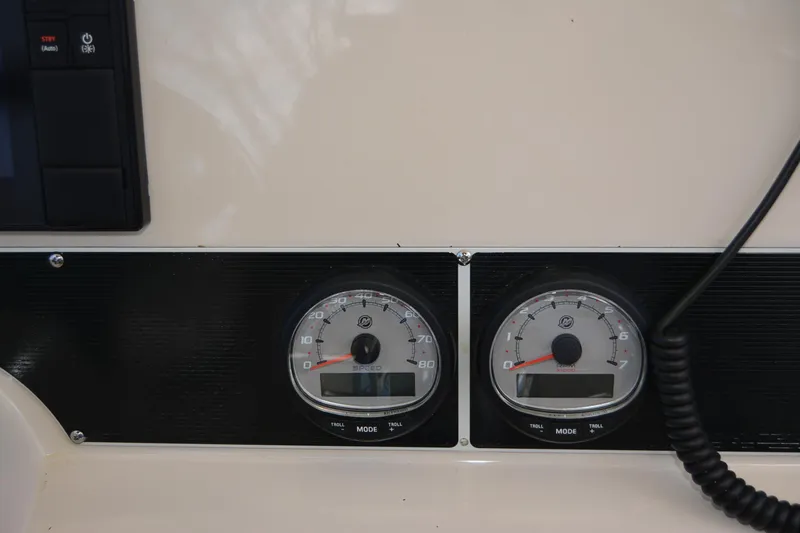 Slide: The Image of Dashboard gauges of a 2021 Boston Whaler 270 Dauntless boat. - 44