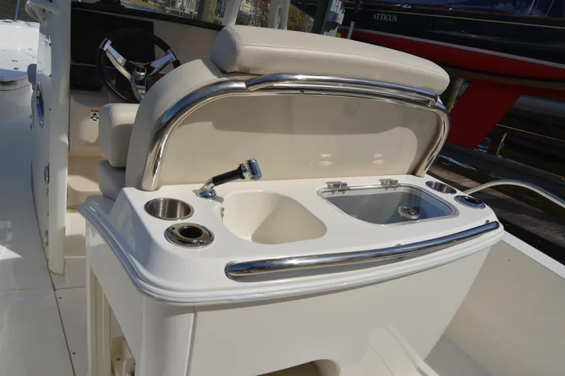 Slide: The Image of 2021 Boston Whaler 270 Dauntless boat interior with helm and sink area. - 47