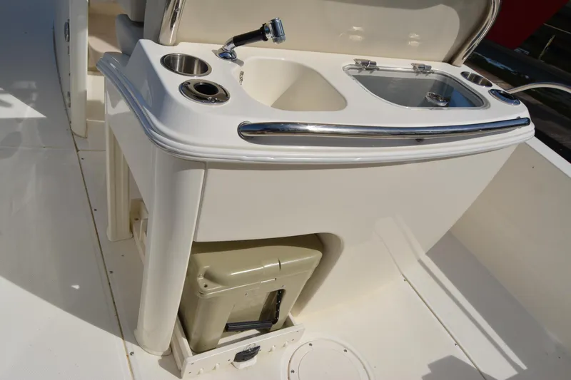 Slide: The Image of 2021 Boston Whaler 270 Dauntless boat sink and storage area. - 48