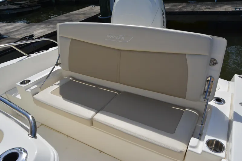 Slide: The Image of 2021 Boston Whaler 270 Dauntless boat seating area with beige cushions. - 51