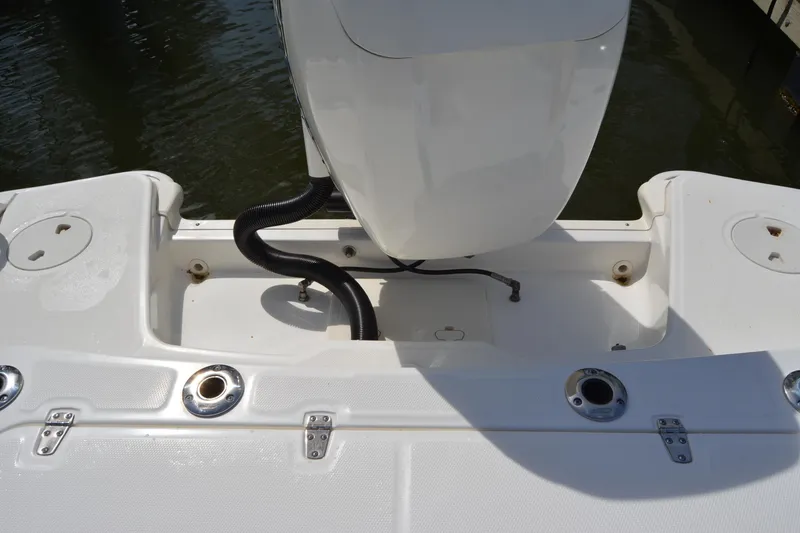 Slide: The Image of 2021 Boston Whaler 270 Dauntless boat stern with motor and fishing rod holders. - 53