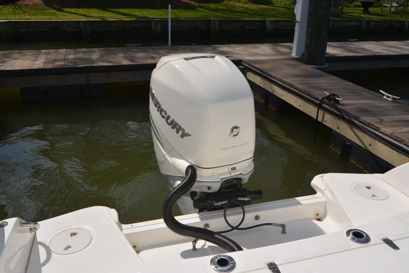 Slide: The Image of 2021 Boston Whaler 270 Dauntless with Mercury outboard engine at dock. - 57
