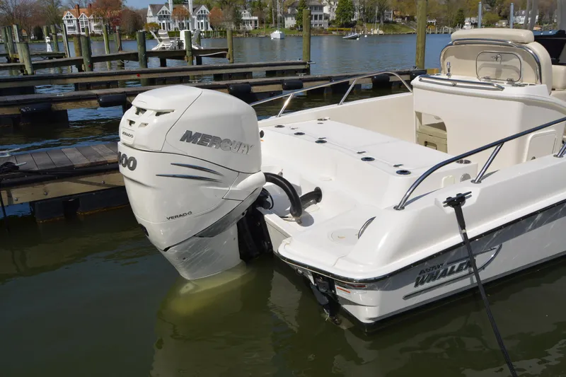 Slide: The Image of 2021 Boston Whaler 270 Dauntless boat with Mercury Verado engine docked at marina. - 59