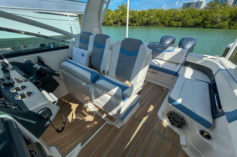 Slide: The Image of 2023 Chaparral 280 OSX boat interior with modern seating and sleek design. - 10