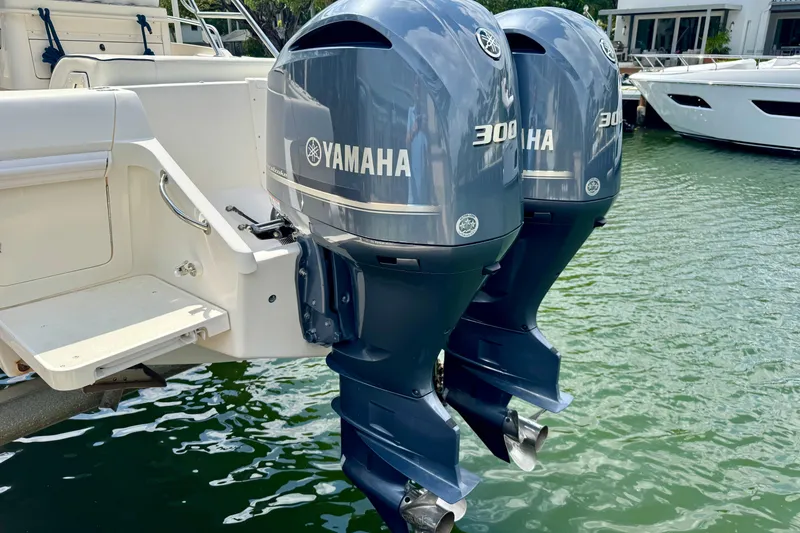 Slide: The Image of Twin Yamaha 300 outboard engines on a 2001 Intrepid 339 Walkaround boat. - 11