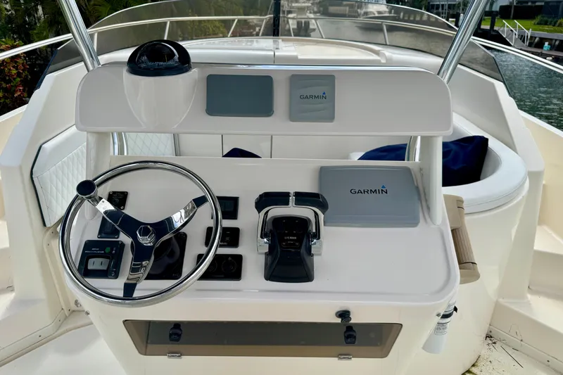 Slide: The Image of Helm of 2001 Intrepid 339 Walkaround with Garmin navigation system and steering wheel. - 15