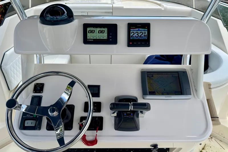 Slide: The Image of Helm of 2001 Intrepid 339 Walkaround with steering wheel, navigation displays, and controls. - 18