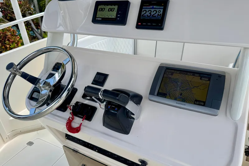 Slide: The Image of 2001 Intrepid 339 Walkaround helm with Garmin GPS and Yamaha controls. - 19