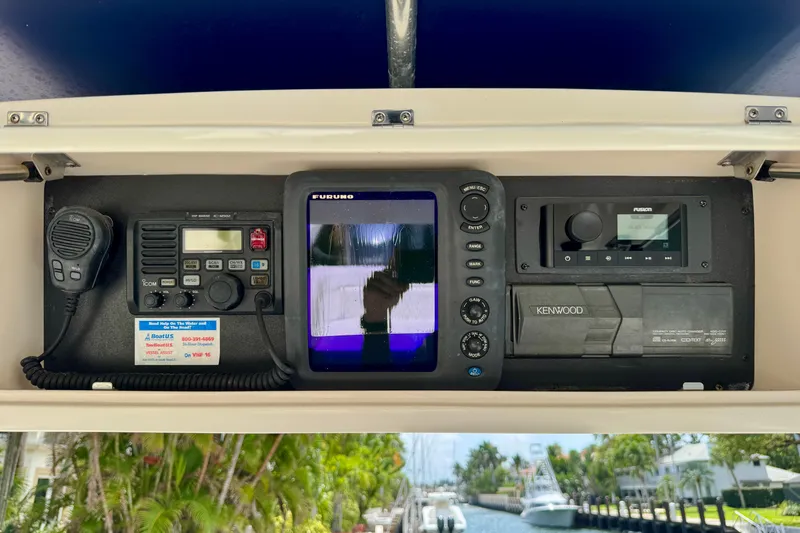 Slide: The Image of 2001 Intrepid 339 Walkaround dashboard with marine electronics and navigation equipment. - 22