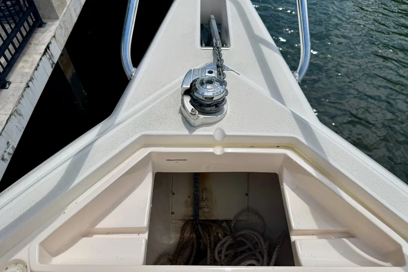 Slide: The Image of Bow of a 2001 Intrepid 339 Walkaround with anchor chain and storage compartment. - 26