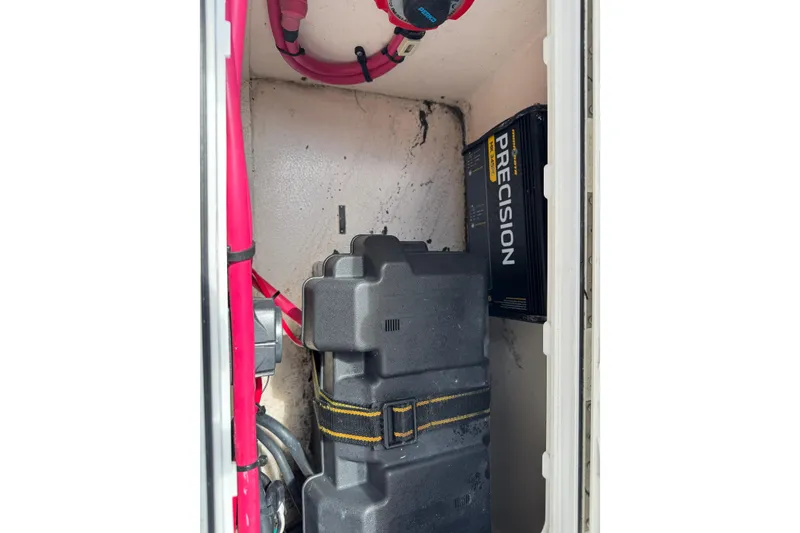 Slide: The Image of 2001 Intrepid 339 Walkaround battery compartment with Precision charger and cables. - 36