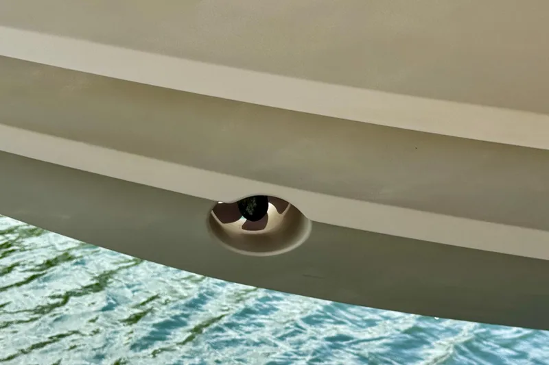 Slide: The Image of Close-up of a 2001 Intrepid 339 Walkaround hull detail above water. - 4