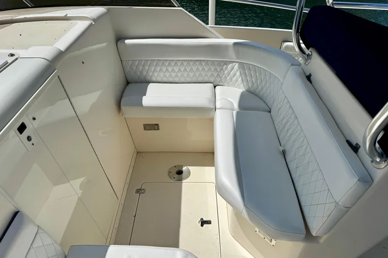 Slide: The Image of Luxurious seating area on a 2001 Intrepid 339 Walkaround boat with quilted upholstery. - 40