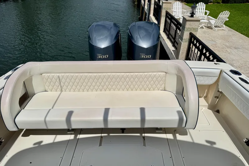 Slide: The Image of 2001 Intrepid 339 Walkaround boat with dual Yamaha 300 engines and cushioned seating. - 6