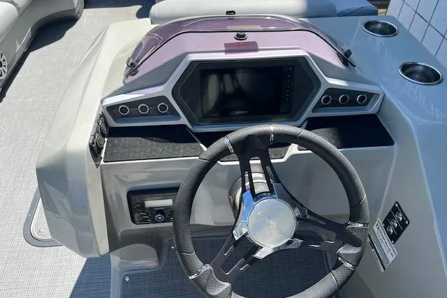 Slide: The Image of 2020 Manitou 25 OASIS SL VP boat dashboard with steering wheel and control panel. - 12